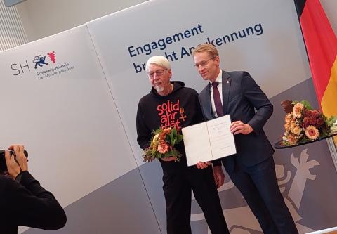 Uwe Borutta und Ministerpräsident Daniel Günther